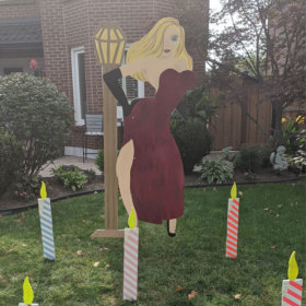 TALL BLONDE LADY WITH LIGHT POST LAWN SIGN